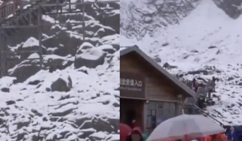 玉龙雪山八月飘雪，雪花散落山间各地